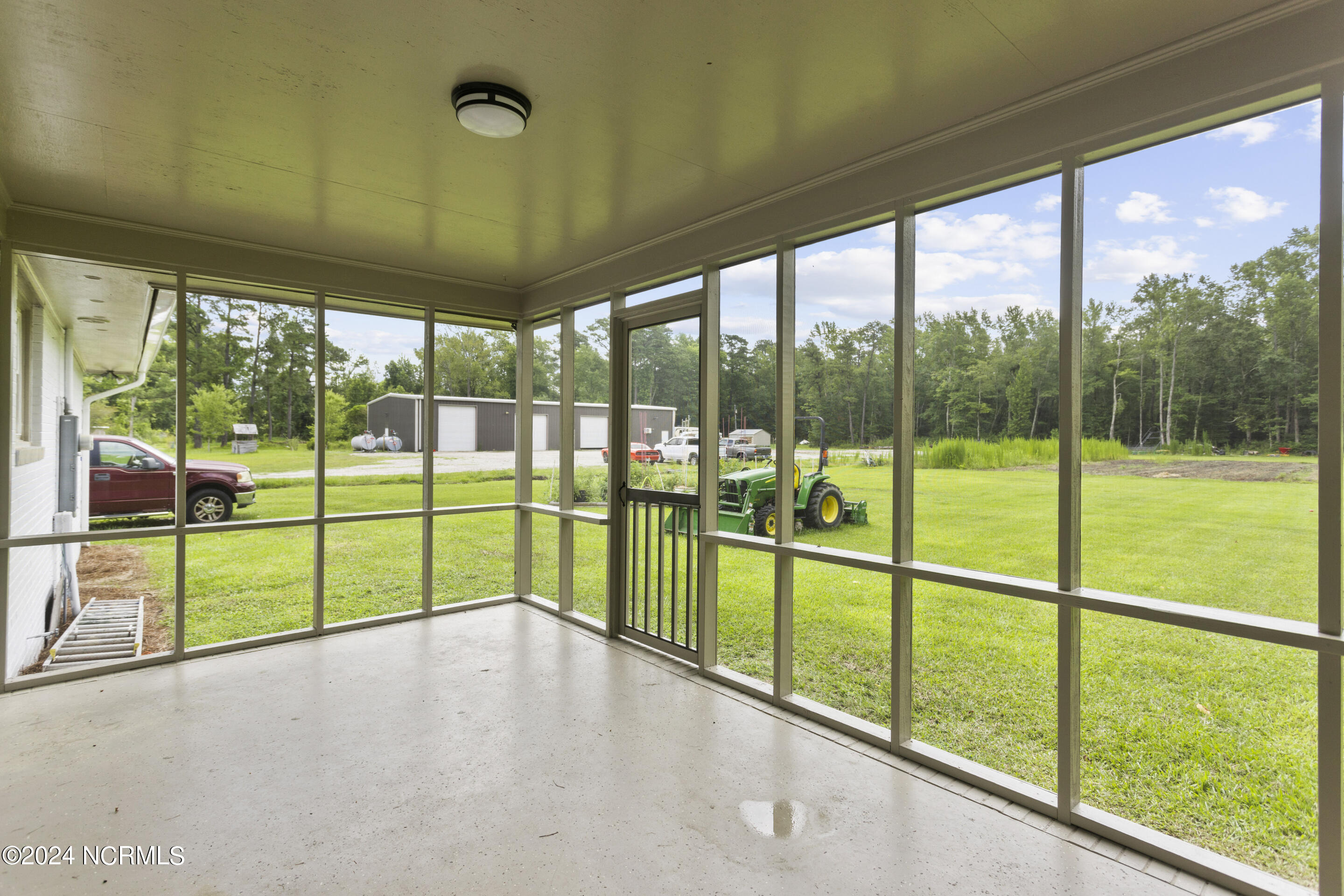 4222 Castle Hayne Road Castle Hayne, NC 28429 - Photo 39 of 52 Large screened in porch