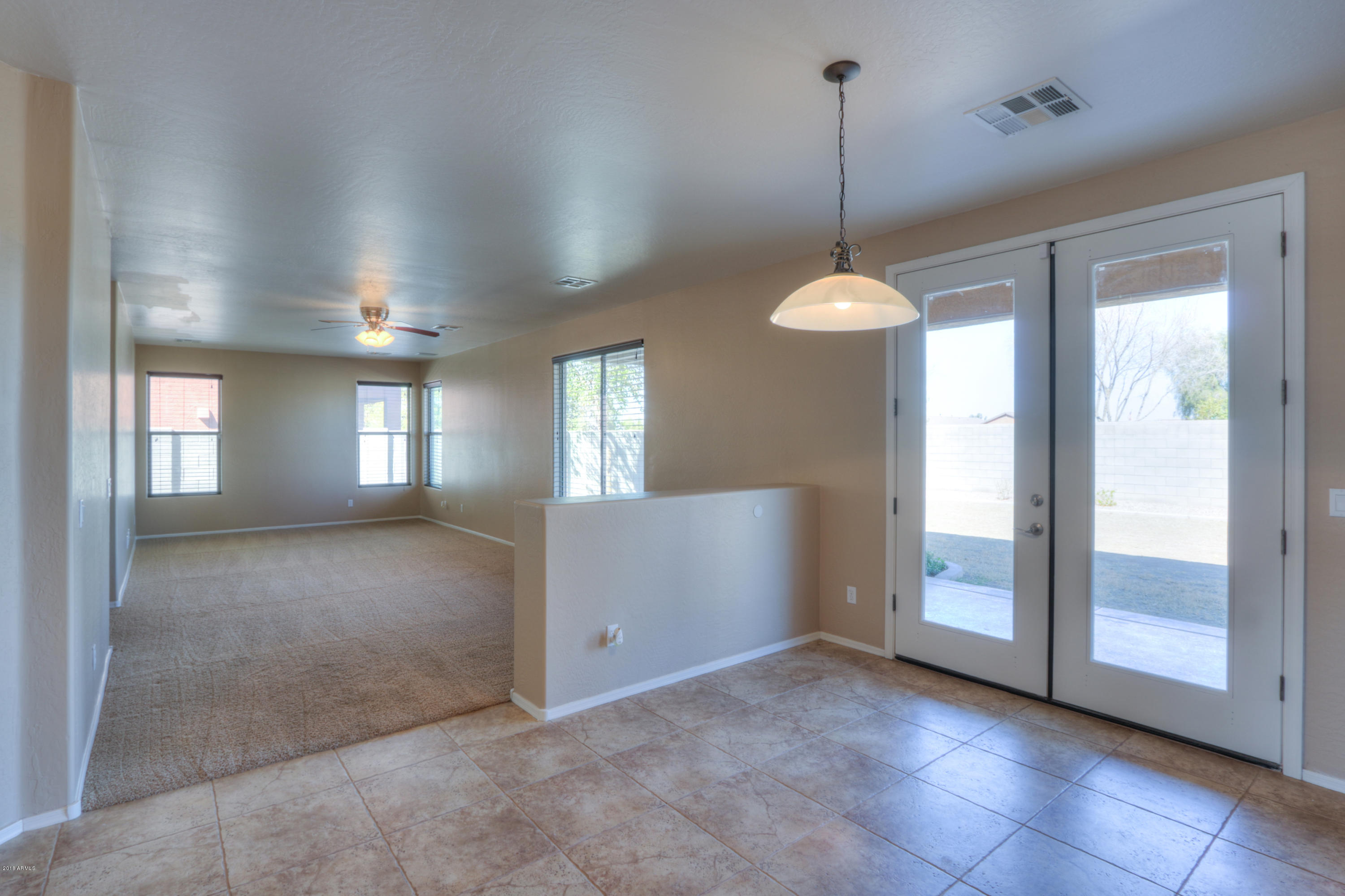 45662 West Mountain View Road Maricopa, AZ 85139 - Photo 16 of 64 French Door to outside patio