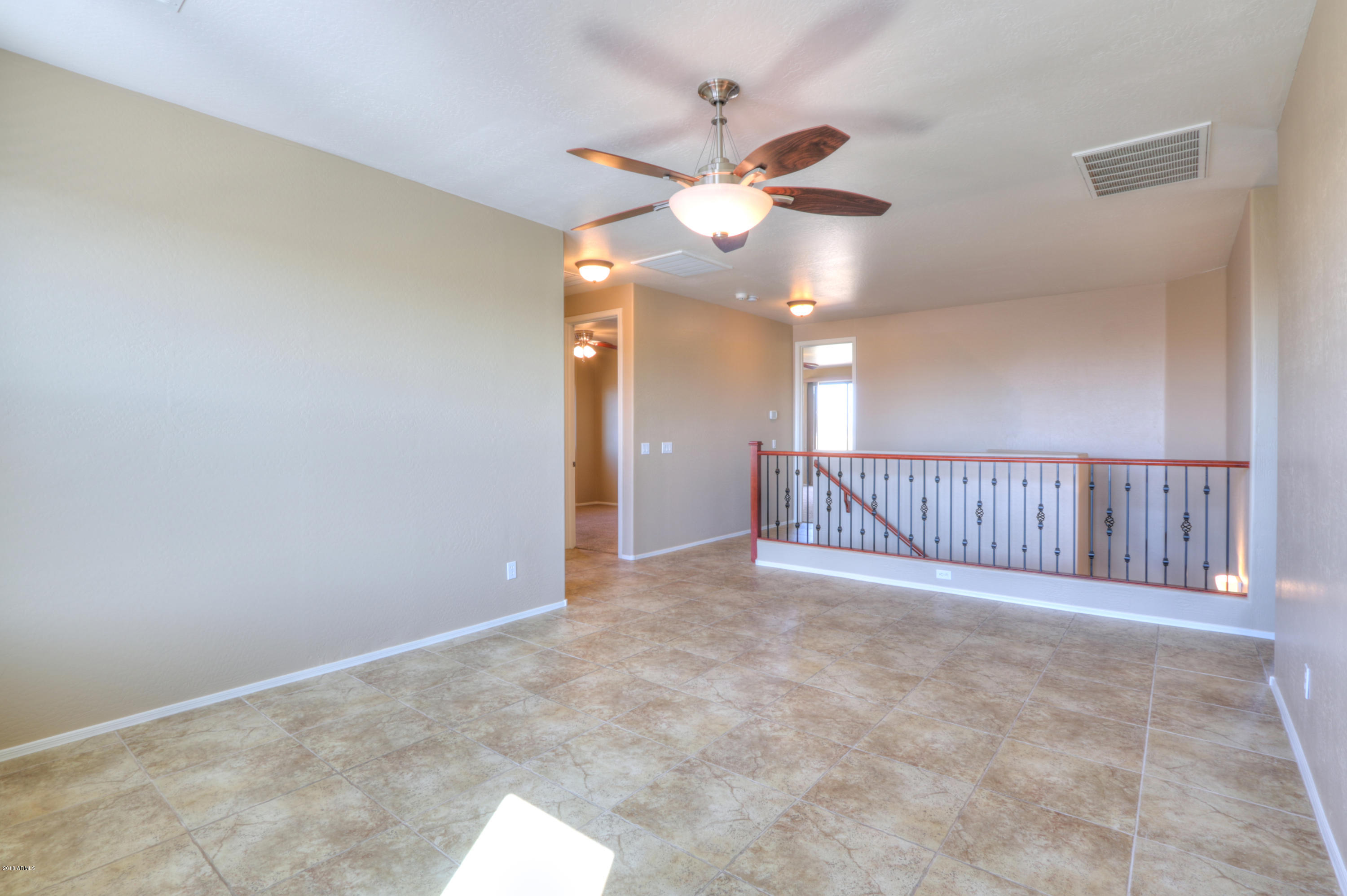 45662 West Mountain View Road Maricopa, AZ 85139 - Photo 31 of 64 Loft overlooking stair banister