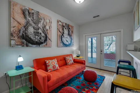 a living room with furniture and a lamp