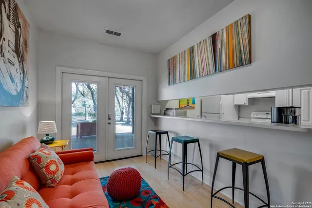 a living room with furniture and a large window