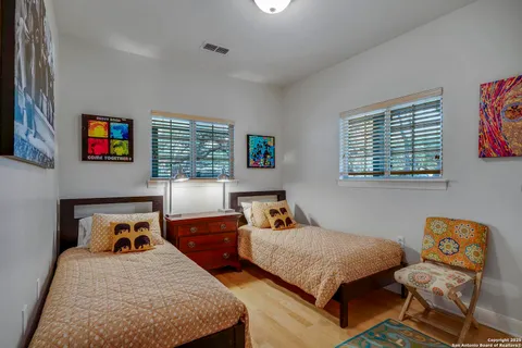 a bedroom with bed and window