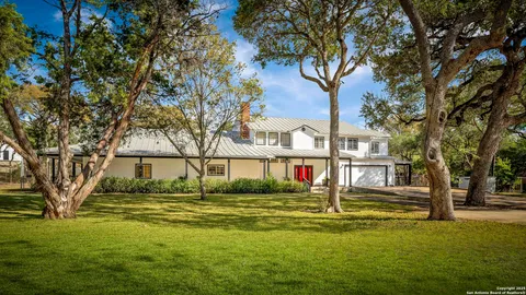 a view of swimming pool and trees