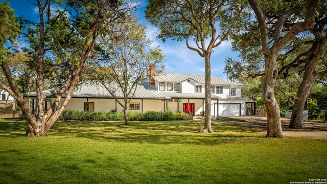 a view of swimming pool and trees