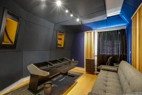 a living room with a couch and a flat screen tv