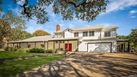 a front view of a house with large windows