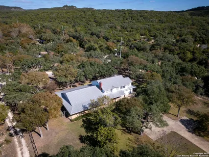 an aerial view of a house with mountain view