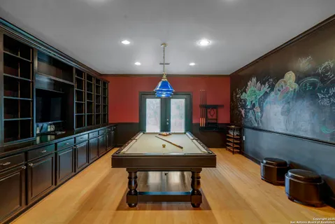 a living room with furniture a rug and a flat screen tv