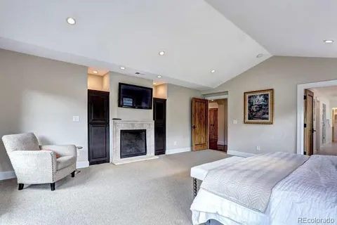 a bedroom with a bed and a couch