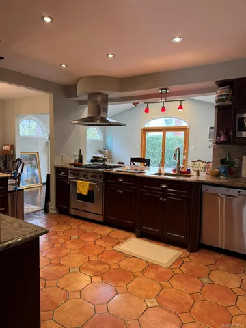 a kitchen with a sink and refrigerator