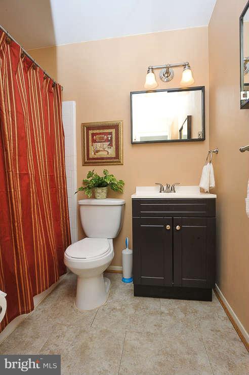 5613 Rathbone Place Springfield, VA 22151 - Photo 11 of 22 a bathroom with a toilet and a sink