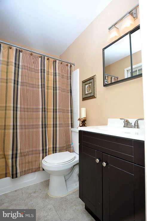 5613 Rathbone Place Springfield, VA 22151 - Photo 14 of 22 a bathroom with a sink and a toilet