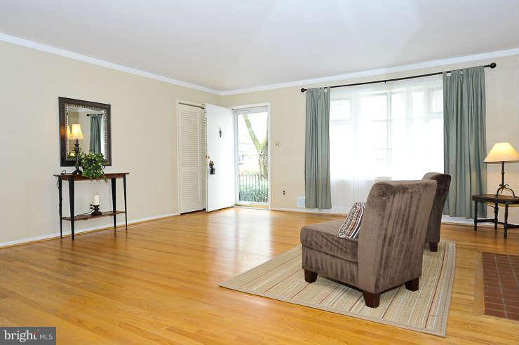 5613 Rathbone Place Springfield, VA 22151 - Photo 3 of 22 a living room with furniture and a large window