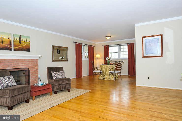 5613 Rathbone Place Springfield, VA 22151 - Photo 5 of 22 a living room with furniture and a fireplace