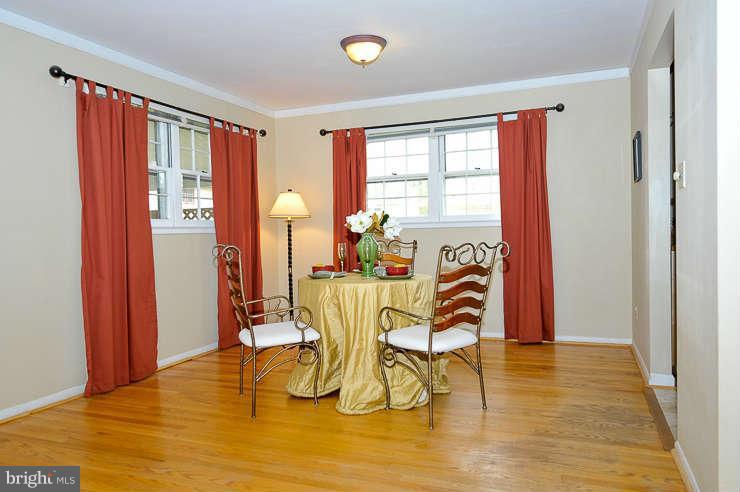 5613 Rathbone Place Springfield, VA 22151 - Photo 6 of 22 a view of a dining room with furniture and wooden floor