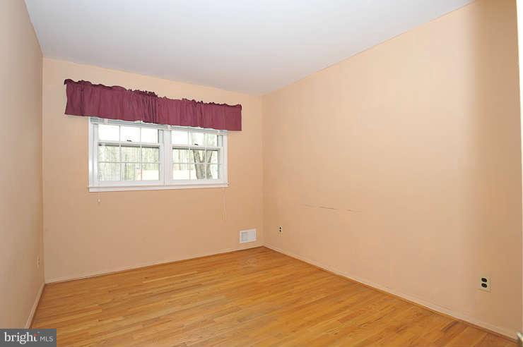 5613 Rathbone Place Springfield, VA 22151 - Photo 9 of 22 a view of empty room with window