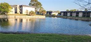 8020 North Colony Circle, Unit 110 Tamarac, FL 33321 - Photo 3 of 11 a view of a lake with houses
