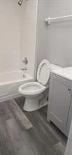 a bathroom with a toilet and a bathtub