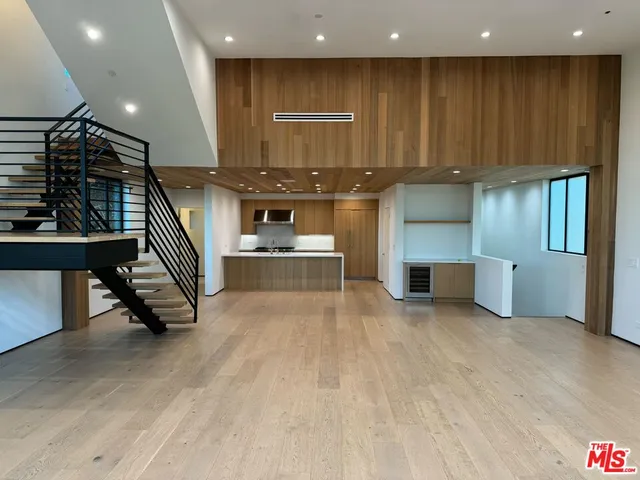 a view of kitchen with furniture and a ceiling fan