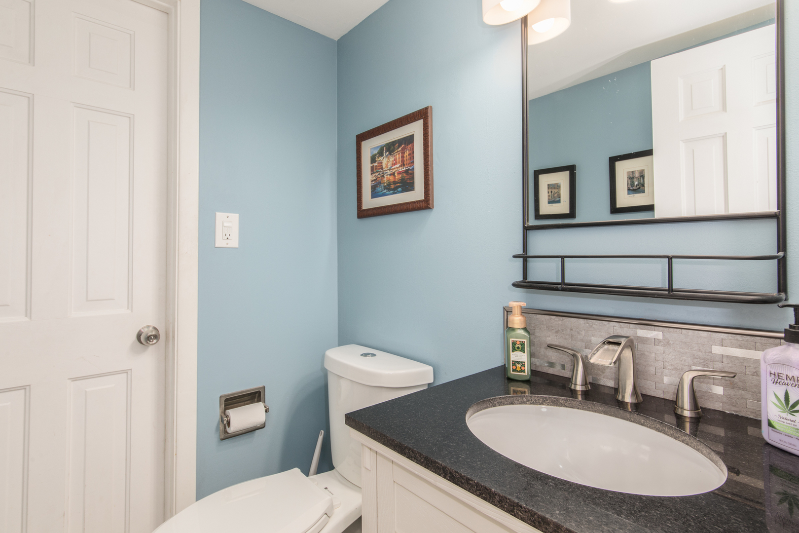 2005 Cayuga Lane Mount Prospect, IL 60056 - Photo 18 of 28 a bathroom with a granite countertop toilet sink and mirror