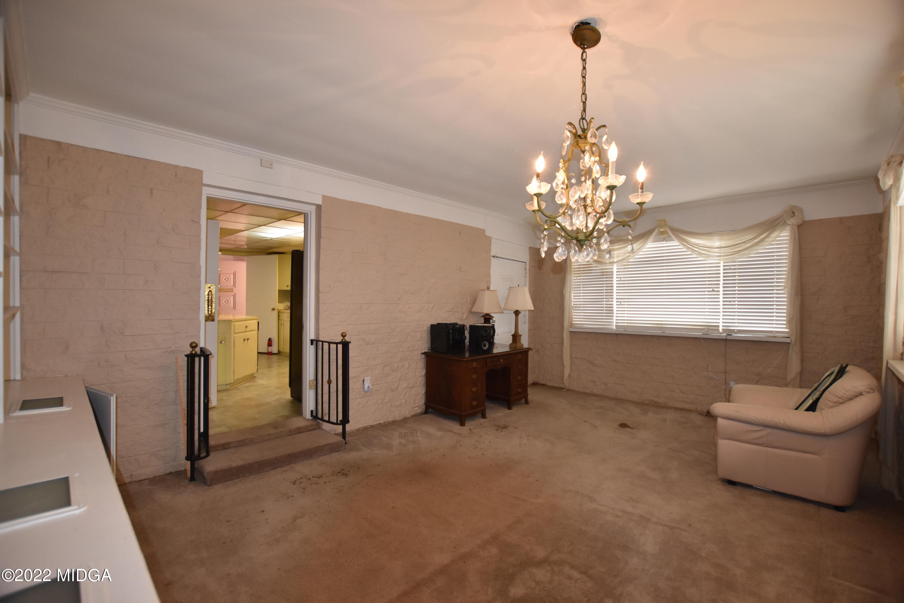 2159 General Winship Drive Macon, GA 31204 - Photo 14 of 31 a living room with furniture and a chandelier