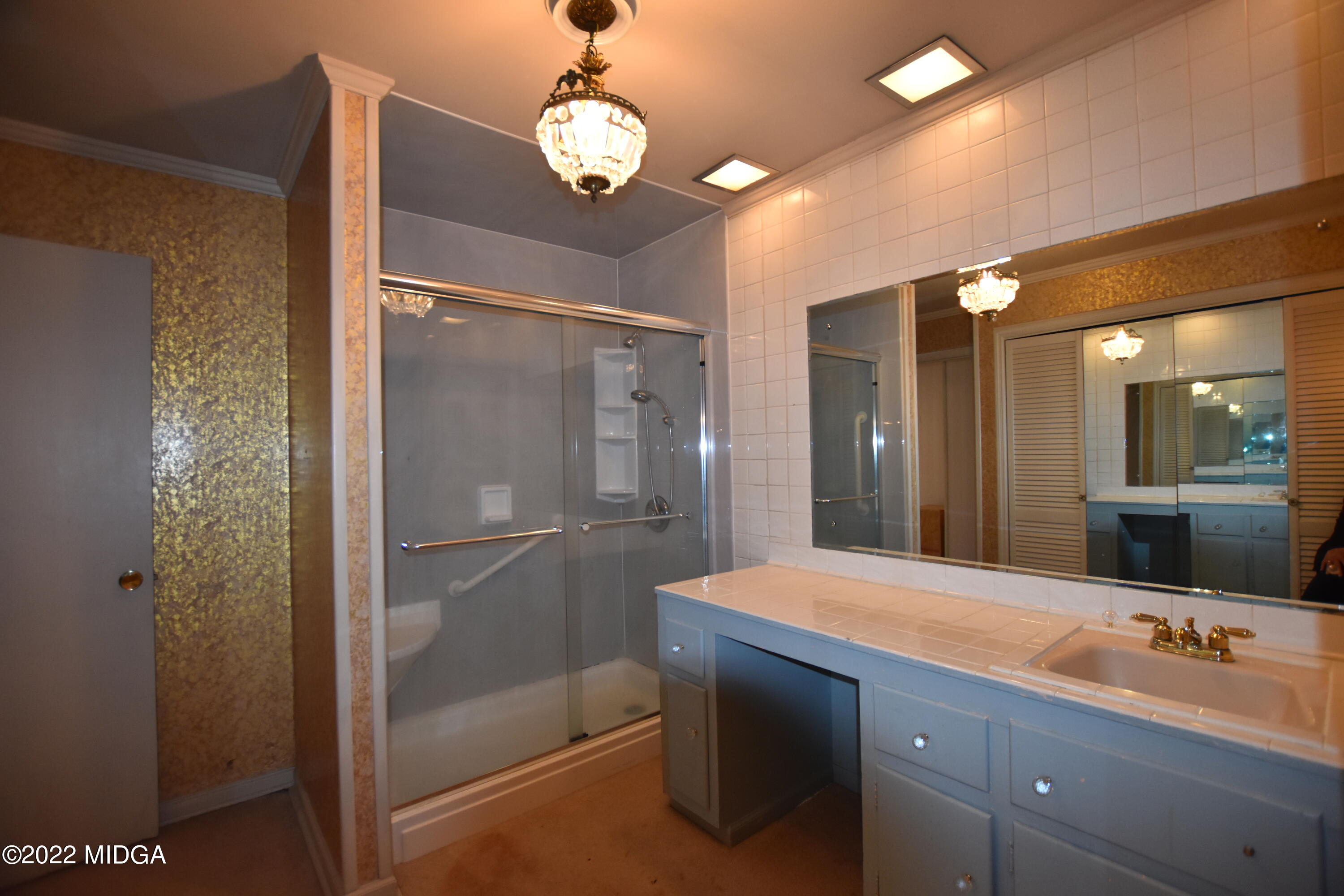 2159 General Winship Drive Macon, GA 31204 - Photo 23 of 31 a bathroom with a granite countertop sink mirror and shower