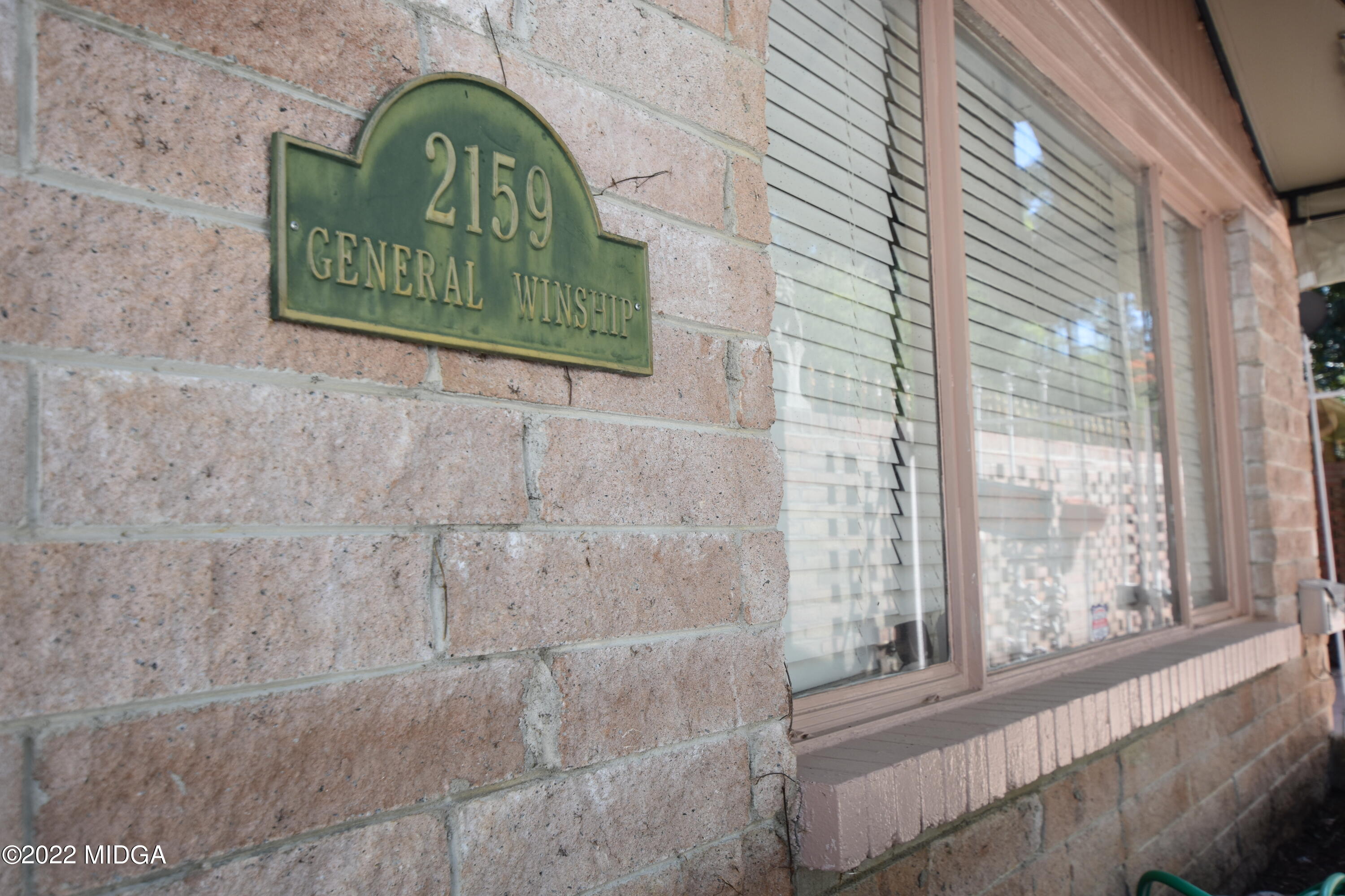 2159 General Winship Drive Macon, GA 31204 - Photo 4 of 31 a view of a door with a street sign