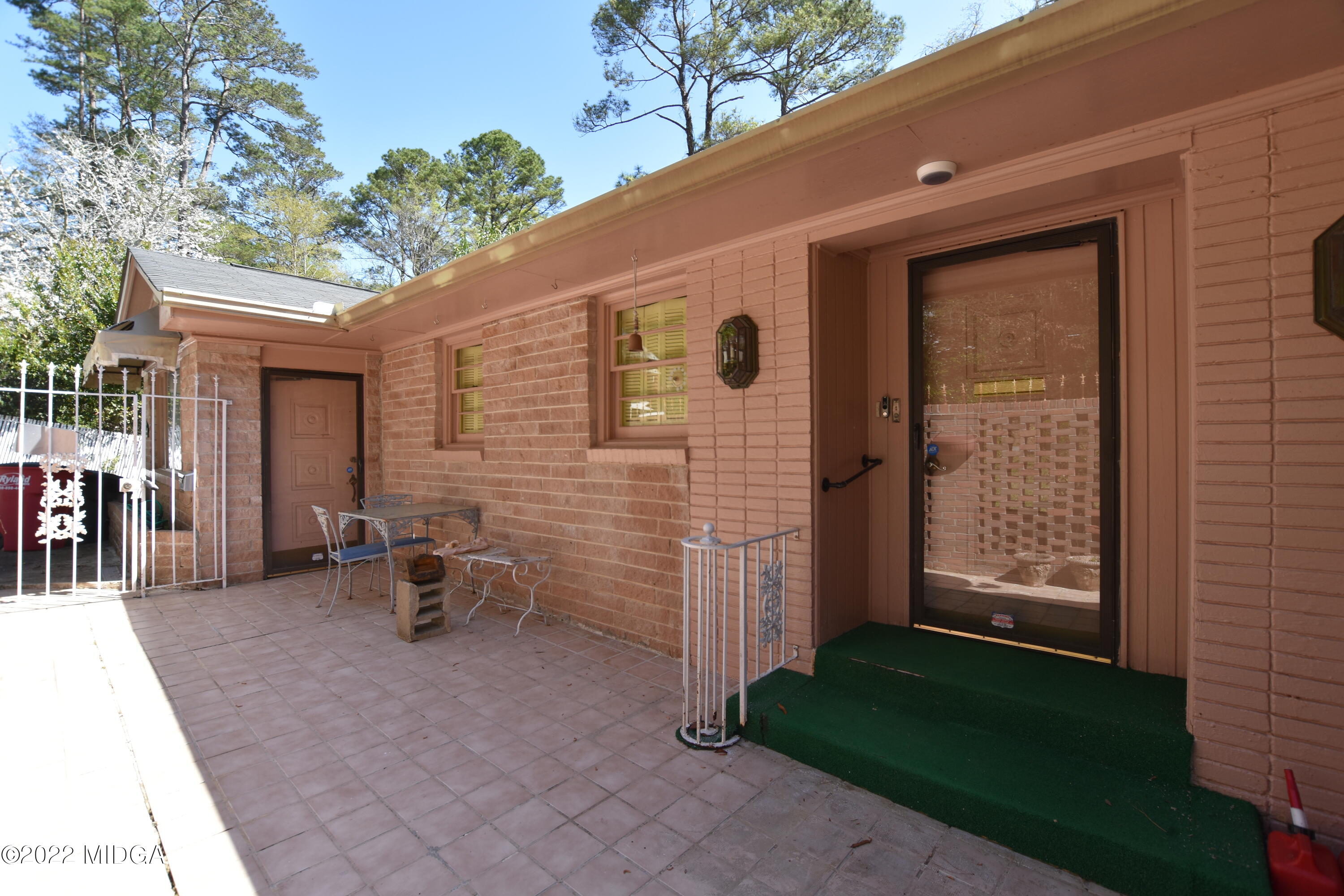 2159 General Winship Drive Macon, GA 31204 - Photo 5 of 31 a view of a patio with table and chairs and potted plants