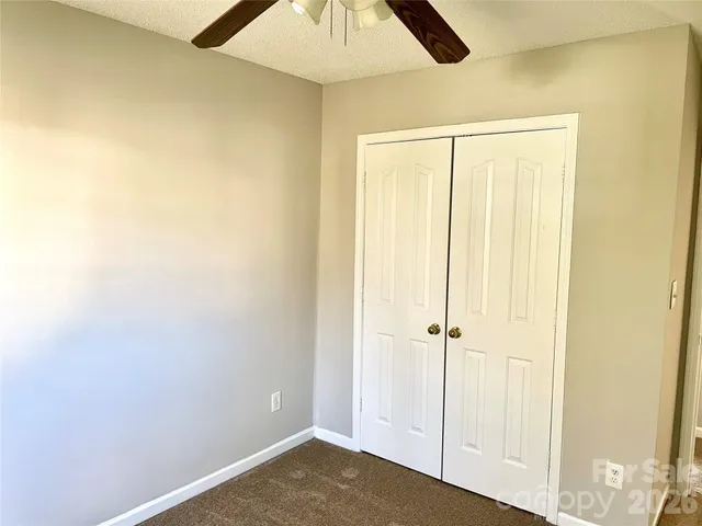 an empty room with a cabinet