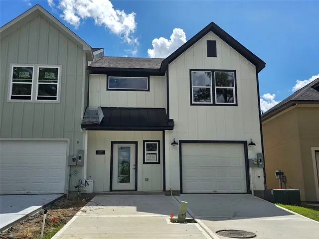 a front view of a house with a garage