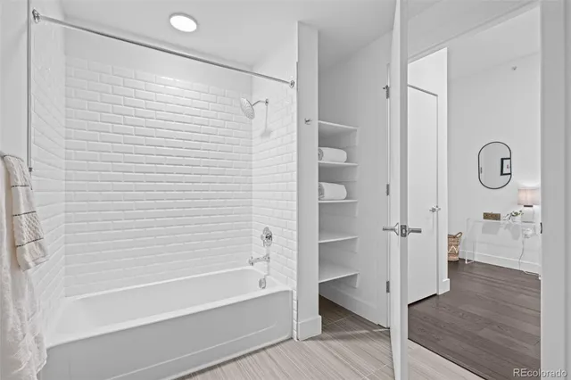 a bathroom with a bathtub and a shower