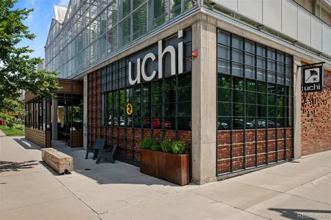 a front view of a building with glass door and shower