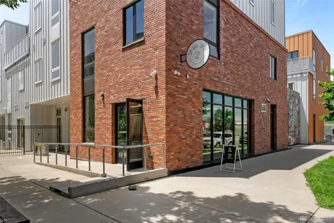 a view of a brick house with a large windows