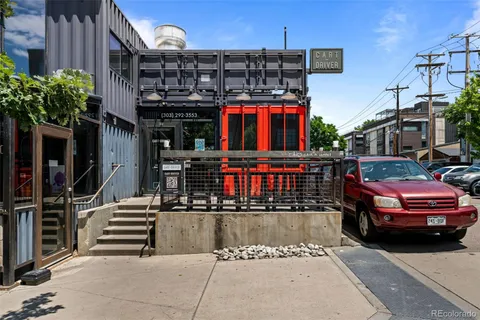 a view of a car park in front of the house