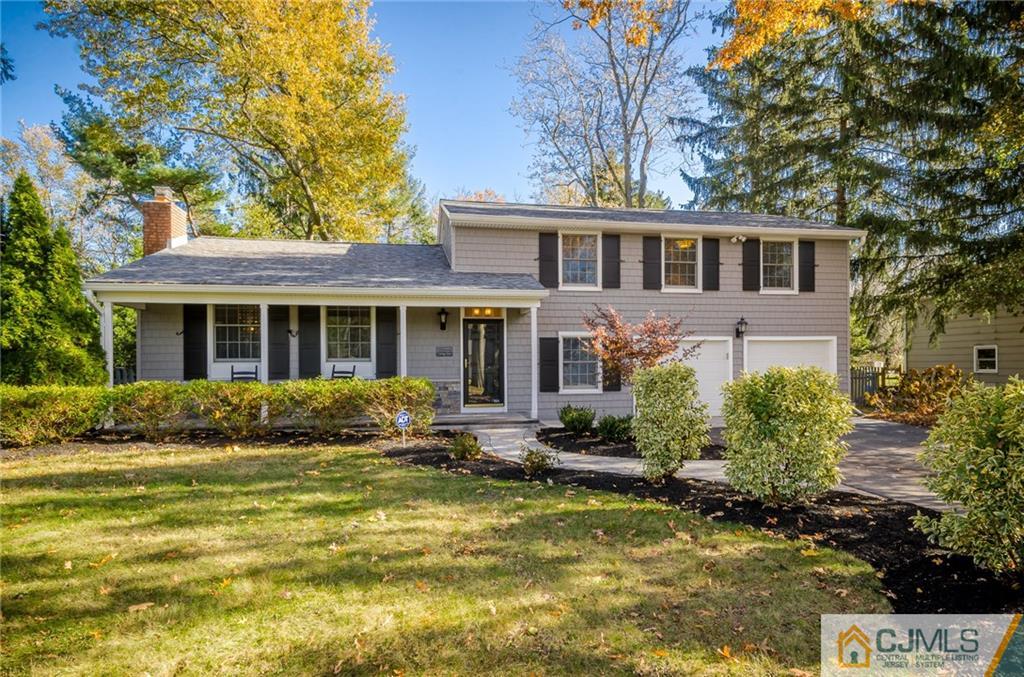 16 Ryan Road Cranbury, NJ 08512 - Photo 1 of 24 a front view of house with yard and trees around
