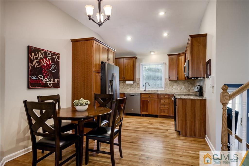 16 Ryan Road Cranbury, NJ 08512 - Photo 2 of 24 a dining room with furniture and wooden floor