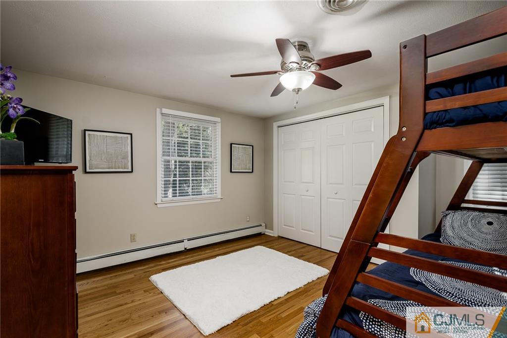 16 Ryan Road Cranbury, NJ 08512 - Photo 14 of 24 a view of an empty room with wooden floor and a window