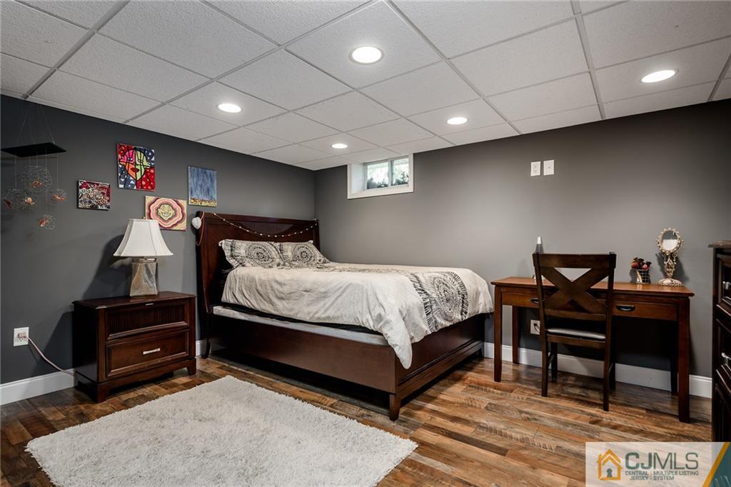 16 Ryan Road Cranbury, NJ 08512 - Photo 17 of 24 a bedroom with a bed a desk and chair