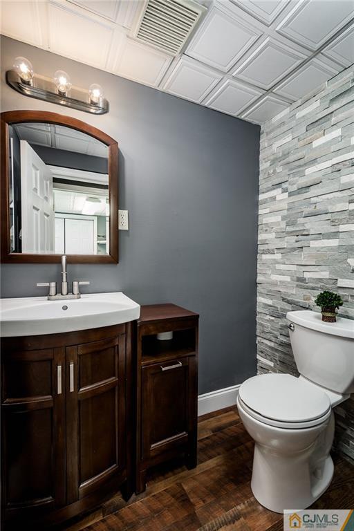 16 Ryan Road Cranbury, NJ 08512 - Photo 18 of 24 a bathroom with a toilet a sink and mirror