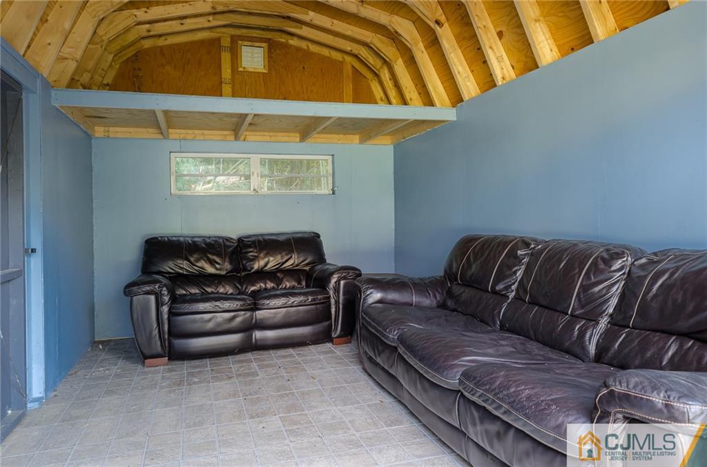16 Ryan Road Cranbury, NJ 08512 - Photo 20 of 24 a living room with a couch and dresser