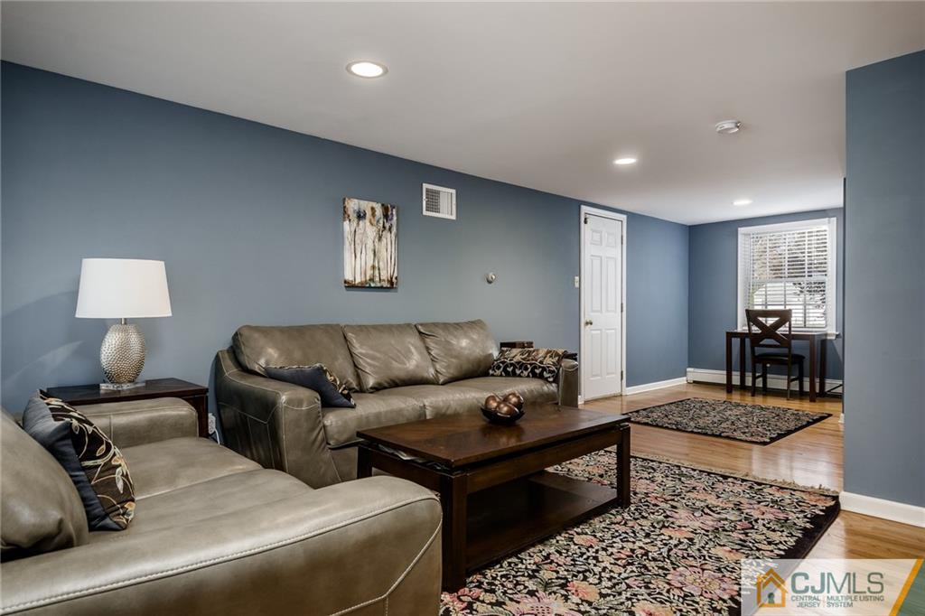 16 Ryan Road Cranbury, NJ 08512 - Photo 8 of 24 a living room with furniture and a couch