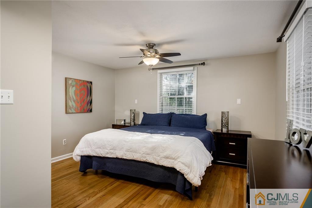 16 Ryan Road Cranbury, NJ 08512 - Photo 10 of 24 a bedroom with a bed and wooden floor