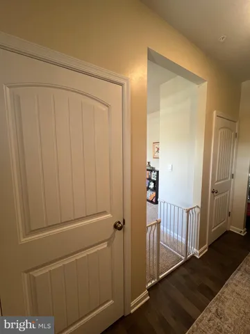 a livingroom with workspace couch and a window