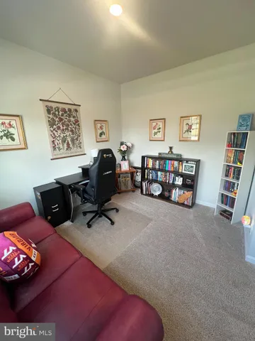 a dining room with a table and chairs