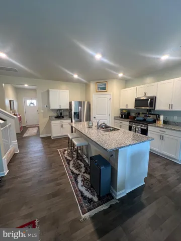 a living room with furniture and a rug