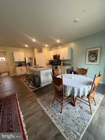 a room with furniture gym equipment and view of living room