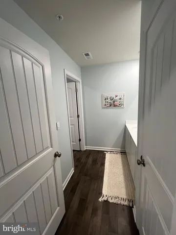 a bedroom with a bed couch tv and a window