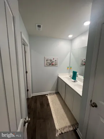 a view of living room with furniture and flat screen tv