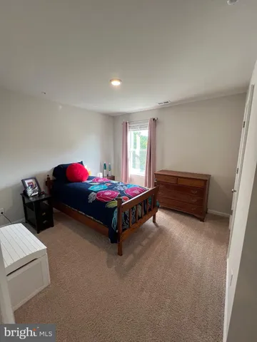 a view of a room with wooden floor and stairs