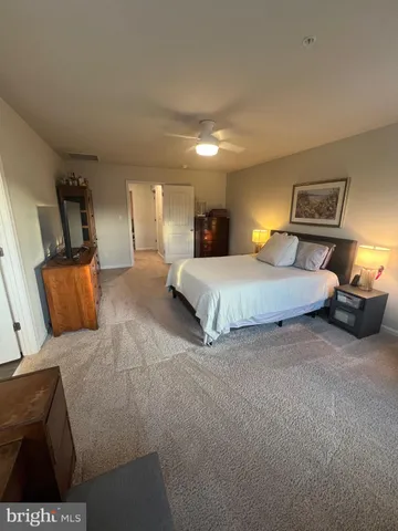 a bedroom with furniture and window